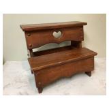 Wooden stool with heart cutout Wooden stool with heart cutout