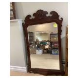 Large wood-framed wall mirror Large wood-framed wall mirror