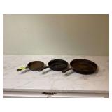 Set of three cast-iron pans Set of three cast-iron pans