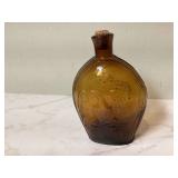 Vintage amber glass bottle with cork Vintage amber glass bottle with cork