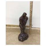 Old glazed statue of embracing couple Old glazed statue of embracing couple