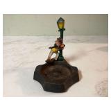 Antique cast-iron ashtray with drunk man on lamp post