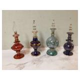 Four colored glass perfume bottles
