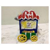 Vintage toy bank shaped like carnival popcorn cart