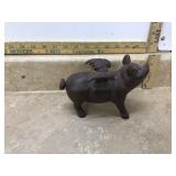 Vintage pig-shaped bank made of cast iron