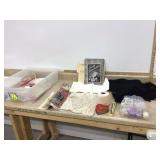 Vintage tote with lid containing old patterns and spools of thread