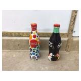Collectible Coke bottles featuring McDonalds logos from around the world