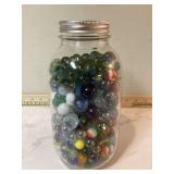 Antique marbles in jar some glow Antique marbles in jar some glow