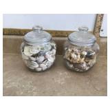 Two glass jars filled with seashells
