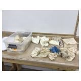 Various doilies and lace in small container with lid