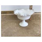 White glass pedestal dish with ruffled edges