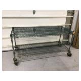 Metal storage unit with 2 shelves and wheels