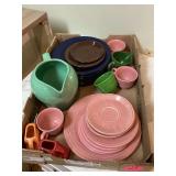 Colorful dishes with water pitcher