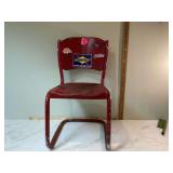 Old red metal seat