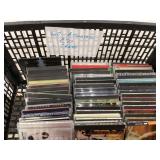 Various music CDs in black crate