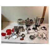 Old cookie cutters and coffee pots