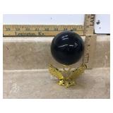 Black glass ball on base