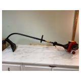 Gas-powered weed trimmer by Troy-Bilt