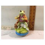 Musical figurine depicting lazy river scene