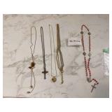 Antique jewelry and rosary in pouch