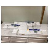 White wide-slat faux wood blinds