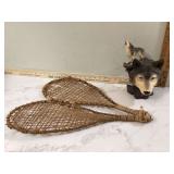 Winter-themed decor featuring wolf figurine and snowshoes