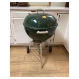 Green Weber charcoal grill outdoor cooking essential