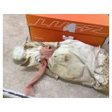 Vintage doll in crib
