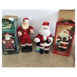 2 SANTA FIGURINES