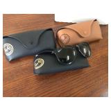 One pair of Ray-Ban sunglasses and three cases
