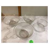 Four nesting glass bowls