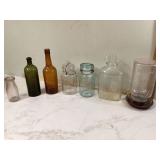 Vintage glass jars and bottles for feeding birds