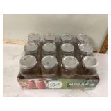 Twelve small canning jars
