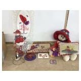 Various red hat-themed trinkets