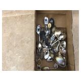 An assortment of souvenir spoons