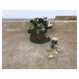 Tiny animal figures on tree base