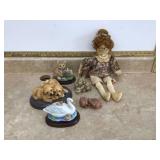 Miniature animal statues and vintage dolls