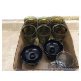 Decor items in green and black; candle holders and drinkware
