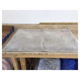 Brand new beige bathroom rug