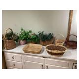 Decorative wicker baskets with fake greenery