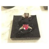 Two silver rings with red stones size 7