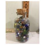Jar filled with vintage marbles