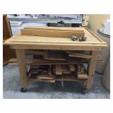 Portable table with wheels and assorted wood pieces