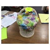 An old ceramic cookie jar shaped like a flower basket