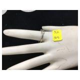 Silver ring with clear stones marked 925 weighs 29