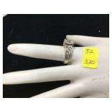 Silver ring with clear stones marked 925 weighs 43