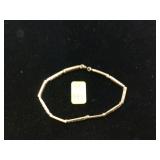 Gold tone silver bracelet with blue stones marked 925 7
