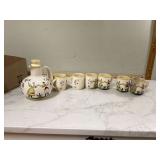 Hand-painted ceramic jug and cups folk art style
