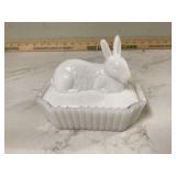 Damaged bunny figurine on nest