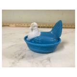 Blue slag glass hen on nest with chip
